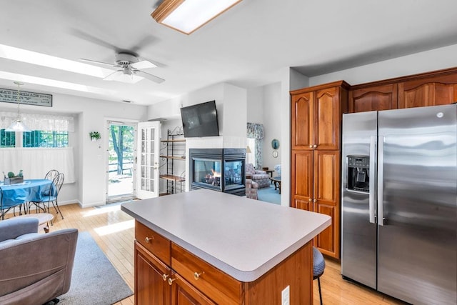 30 Julia Cir, Middle Island, NY 11953 - kitchen with stainless steel fridge, open floor plan, a center island, and ceiling fan