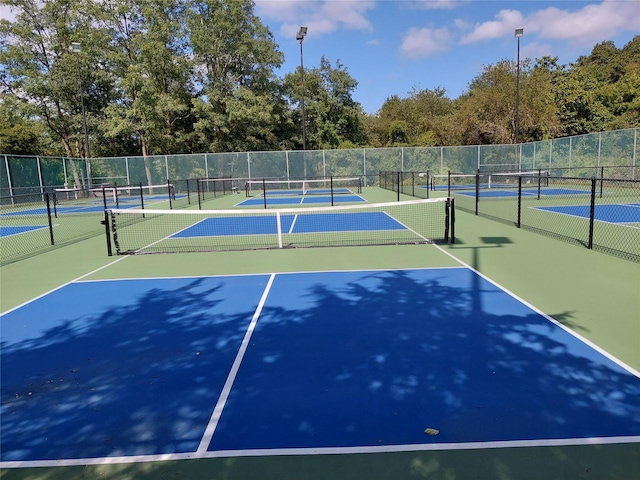 30 Julia Cir, Middle Island, NY 11953 - view of tennis court with fence, community basketball court, and view of scattered trees