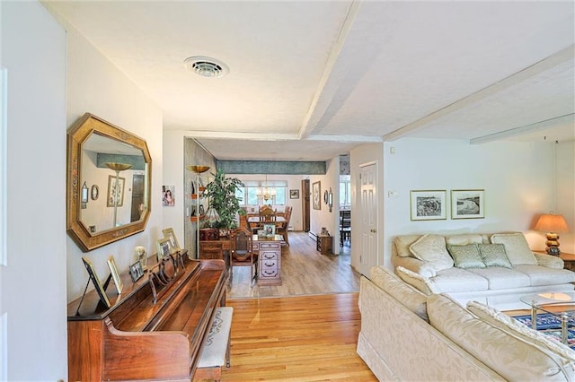 198 Dillon Rd, Monticello, NY 12701 - living area featuring light wood finished floors and a chandelier