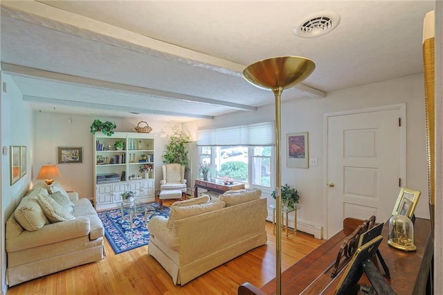 198 Dillon Rd, Monticello, NY 12701 - living room with a baseboard radiator, beamed ceiling, and light wood finished floors