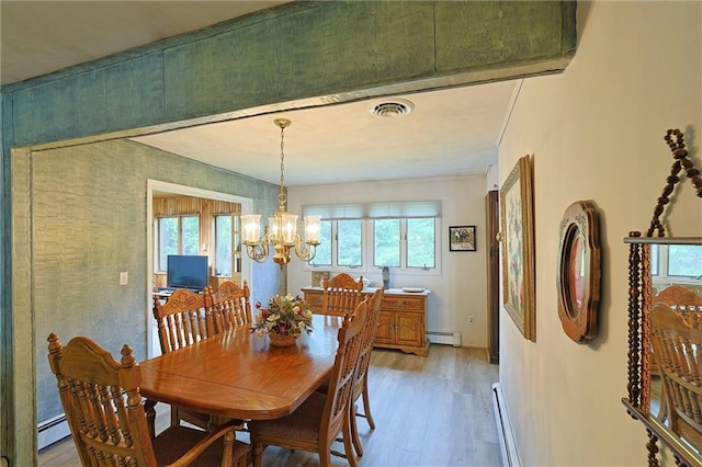 198 Dillon Rd, Monticello, NY 12701 - dining space featuring light wood-type flooring, a baseboard radiator, plenty of natural light, and a chandelier