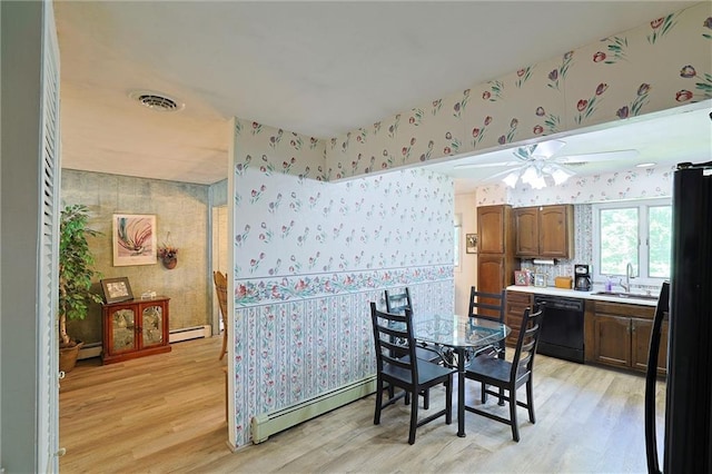 198 Dillon Rd, Monticello, NY 12701 - dining space featuring wallpapered walls, a baseboard radiator, light wood-style flooring, and ceiling fan
