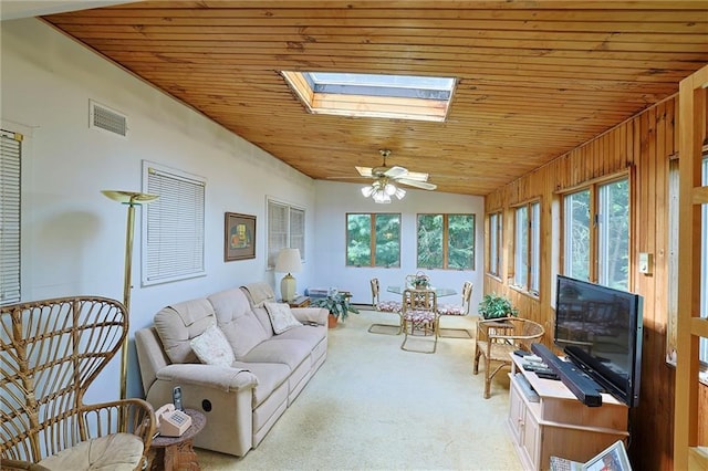 198 Dillon Rd, Monticello, NY 12701 - carpeted living area with wood ceiling, vaulted ceiling, a skylight, and ceiling fan