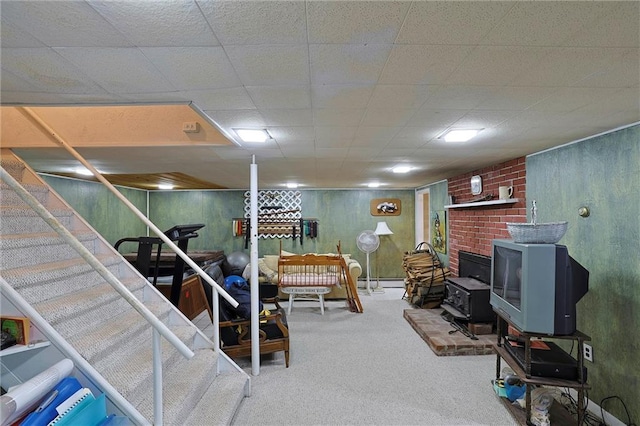 198 Dillon Rd, Monticello, NY 12701 - finished below grade area with a wood stove, carpet, and a baseboard radiator