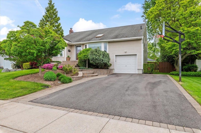 26 Tioga Dr, Jericho, NY 11753 - view of front of property with driveway and a chimney