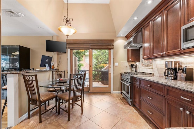 26 Tioga Dr, Jericho, NY 11753 - kitchen with stainless steel appliances, wall chimney range hood, tasteful backsplash, light stone counters, and lofted ceiling