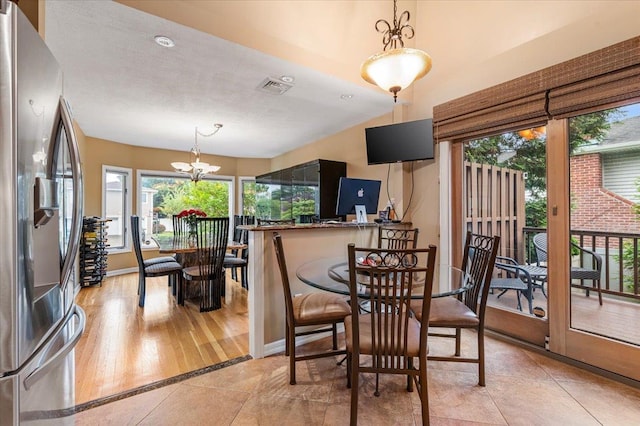 26 Tioga Dr, Jericho, NY 11753 - dining area with a chandelier and baseboards