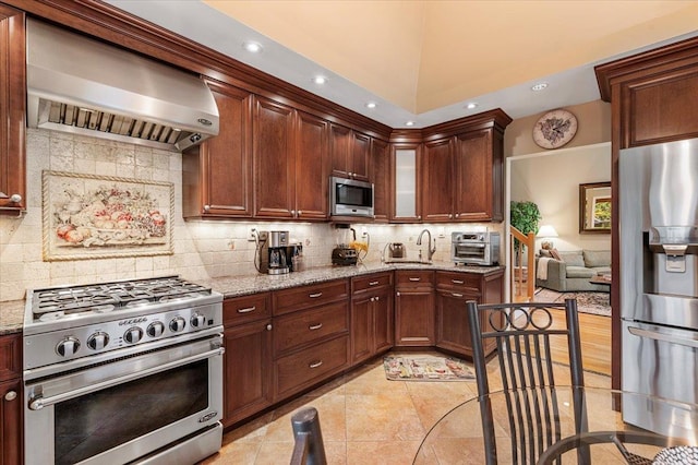 26 Tioga Dr, Jericho, NY 11753 - kitchen with appliances with stainless steel finishes, wall chimney exhaust hood, decorative backsplash, light stone counters, and a sink
