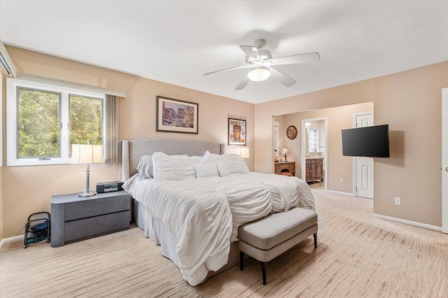 26 Tioga Dr, Jericho, NY 11753 - bedroom featuring baseboards, light carpet, ceiling fan, and ensuite bathroom