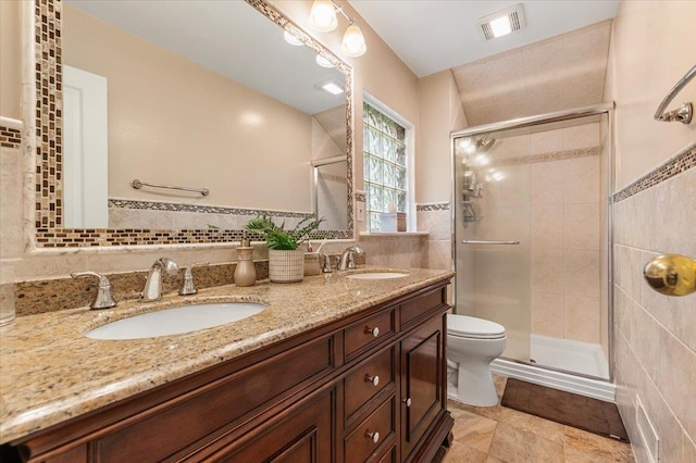 26 Tioga Dr, Jericho, NY 11753 - bathroom featuring tile walls, a stall shower, toilet, and double vanity