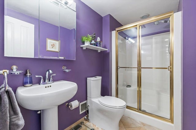 26 Tioga Dr, Jericho, NY 11753 - bathroom with a shower stall, toilet, tile patterned flooring, and a sink