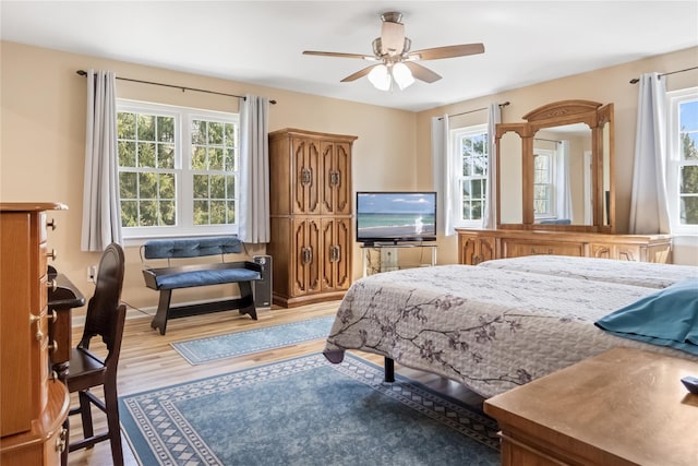bedroom with wood finished floors and ceiling fan