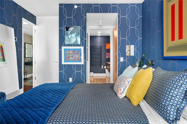 bedroom with wallpapered walls and baseboards