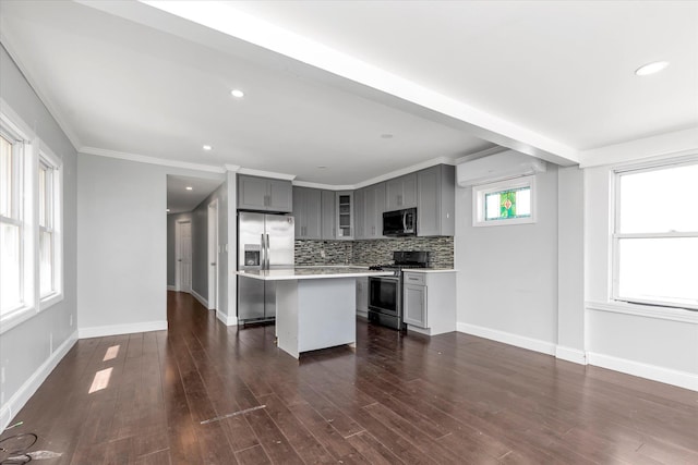 119-64 177th St, Saint Albans, NY 11434 - kitchen with stainless steel appliances, gray cabinetry, a center island, light countertops, and tasteful backsplash