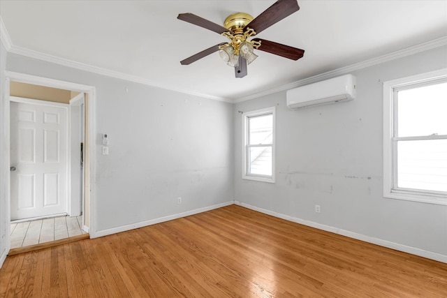 119-64 177th St, Saint Albans, NY 11434 - empty room with a wall unit AC, light wood-type flooring, a ceiling fan, baseboards, and ornamental molding