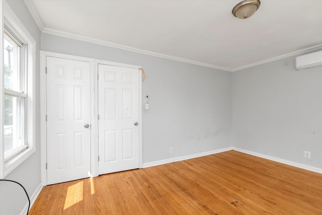 119-64 177th St, Saint Albans, NY 11434 - unfurnished bedroom featuring light wood finished floors, multiple windows, baseboards, ornamental molding, and a wall mounted AC