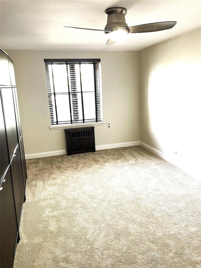 88-10 32nd Ave Unit 201, East Elmhurst, NY 11369 - carpeted spare room featuring a ceiling fan and baseboards