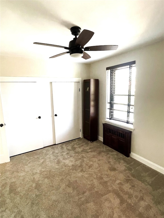 88-10 32nd Ave Unit 201, East Elmhurst, NY 11369 - unfurnished bedroom featuring carpet floors, ceiling fan, and baseboards