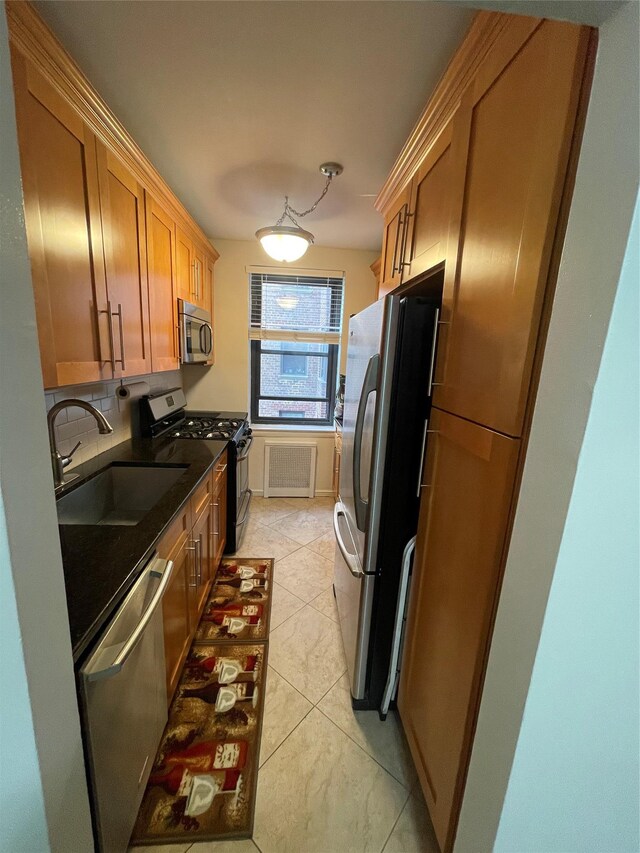 88-10 32nd Ave Unit 201, East Elmhurst, NY 11369 - kitchen with stainless steel appliances, a sink, decorative backsplash, light tile patterned floors, and brown cabinetry