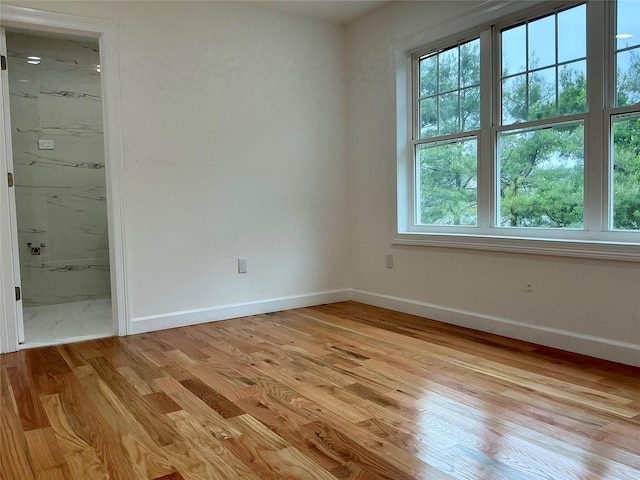 139 Miller Ave SW, Amityville, NY 11701 - spare room featuring light wood-style floors and baseboards
