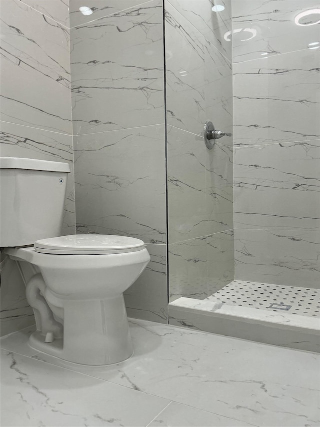 139 Miller Ave SW, Amityville, NY 11701 - bathroom featuring toilet, a marble finish shower, marble finish flooring, and tile walls