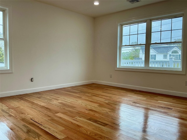 139 Miller Ave SW, Amityville, NY 11701 - spare room featuring plenty of natural light, light wood-style floors, baseboards, and recessed lighting