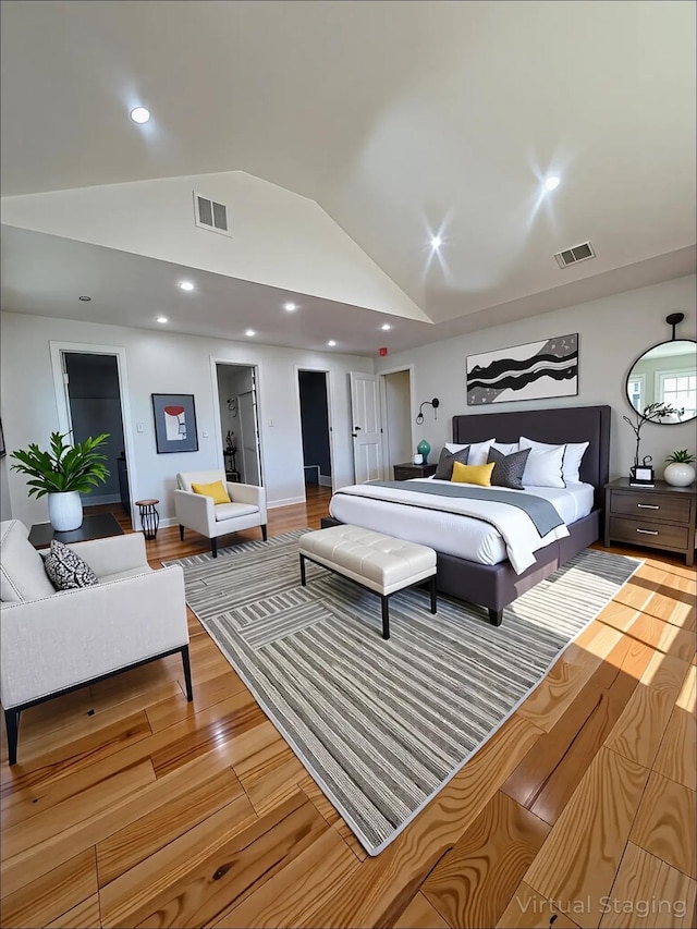 139 Miller Ave SW, Amityville, NY 11701 - bedroom featuring vaulted ceiling, wood finished floors, and recessed lighting