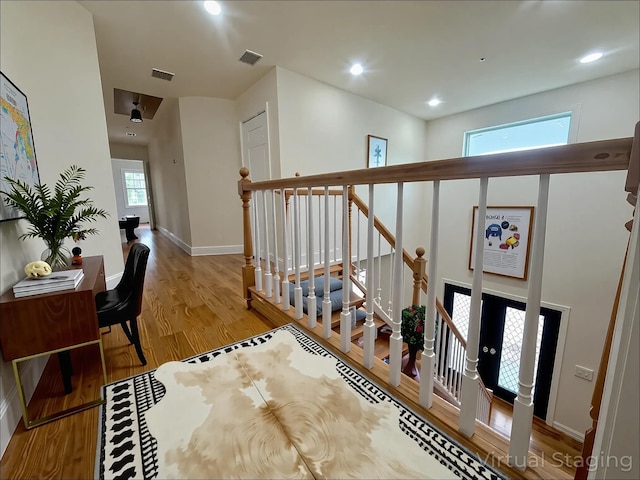 139 Miller Ave SW, Amityville, NY 11701 - corridor featuring wood finished floors, baseboards, and recessed lighting