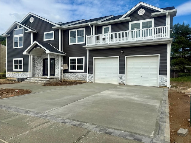 139 Miller Ave SW, Amityville, NY 11701 - view of front of house featuring stone siding, a balcony, a garage, and concrete driveway