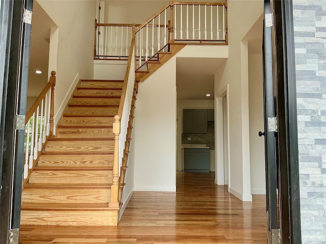 139 Miller Ave SW, Amityville, NY 11701 - staircase featuring wood finished floors and baseboards