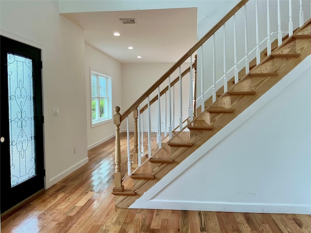 139 Miller Ave SW, Amityville, NY 11701 - foyer entrance with stairs, baseboards, wood finished floors, and recessed lighting