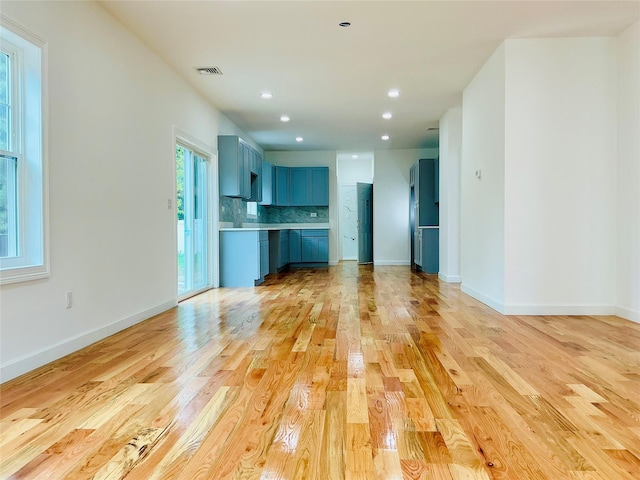 139 Miller Ave SW, Amityville, NY 11701 - unfurnished living room featuring light wood-type flooring, baseboards, and recessed lighting