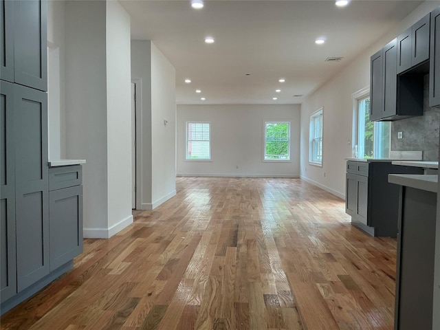 139 Miller Ave SW, Amityville, NY 11701 - kitchen featuring recessed lighting, light wood finished floors, baseboards, and gray cabinetry