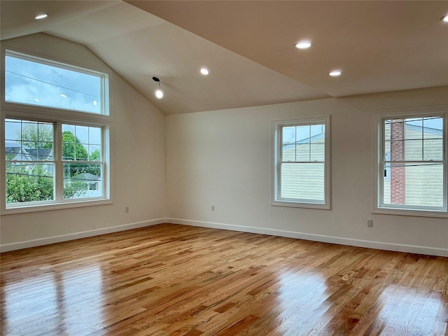 139 Miller Ave SW, Amityville, NY 11701 - unfurnished room with plenty of natural light, vaulted ceiling, light wood finished floors, baseboards, and recessed lighting