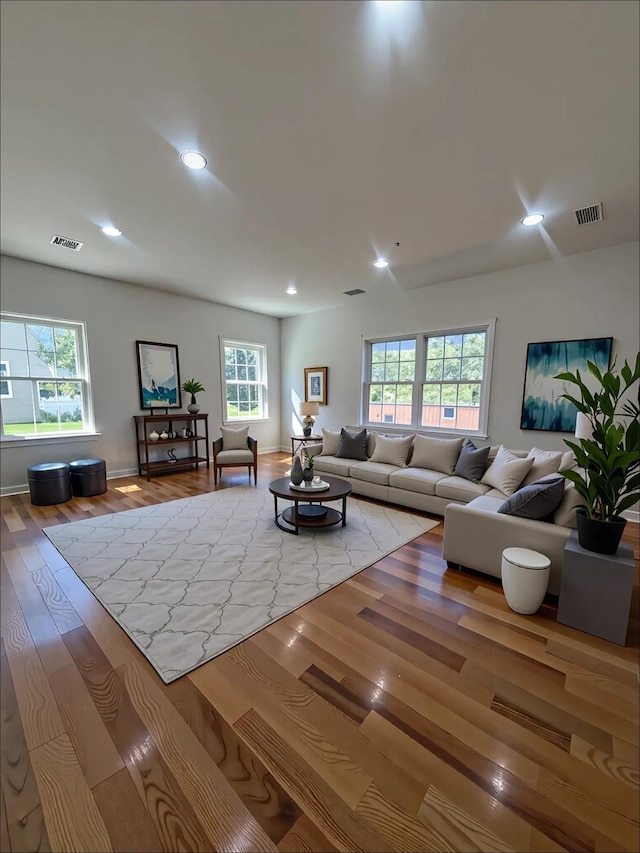 139 Miller Ave SW, Amityville, NY 11701 - living area with wood finished floors, recessed lighting, and baseboards