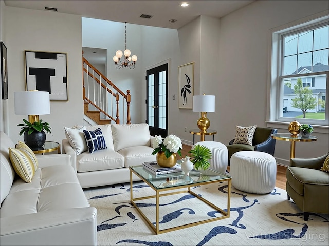 139 Miller Ave SW, Amityville, NY 11701 - living area with stairs, a chandelier, wood finished floors, and recessed lighting