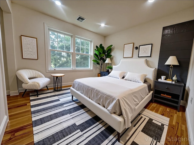 139 Miller Ave SW, Amityville, NY 11701 - bedroom featuring wood finished floors, baseboards, and recessed lighting
