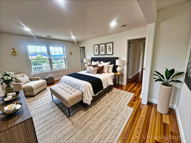 139 Miller Ave SW, Amityville, NY 11701 - bedroom with wood finished floors, baseboards, and recessed lighting