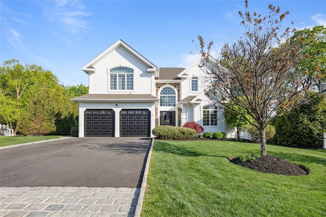 6 Murphy Ct, Blauvelt, NY 10913 - traditional-style home featuring an attached garage, driveway, stucco siding, and a front yard