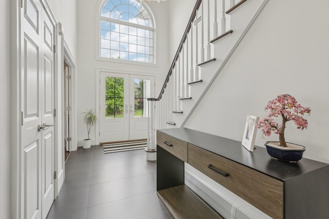 6 Murphy Ct, Blauvelt, NY 10913 - foyer with a towering ceiling, french doors, stairway, and dark tile patterned flooring