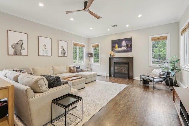 6 Murphy Ct, Blauvelt, NY 10913 - living area featuring wood finished floors, a ceiling fan, recessed lighting, ornamental molding, and a glass covered fireplace