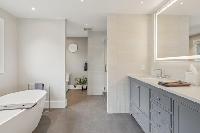 6 Murphy Ct, Blauvelt, NY 10913 - full bathroom with a stall shower, vanity, a freestanding bath, recessed lighting, and baseboards