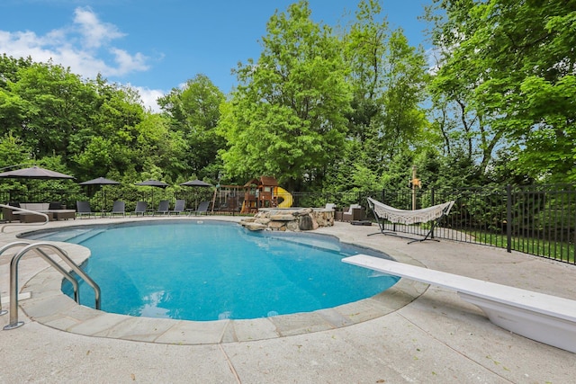 6 Murphy Ct, Blauvelt, NY 10913 - view of swimming pool with a patio area, fence, a diving board, and view of scattered trees