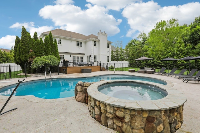 6 Murphy Ct, Blauvelt, NY 10913 - view of swimming pool featuring a wooden deck, fence, a patio, and a pool with connected hot tub
