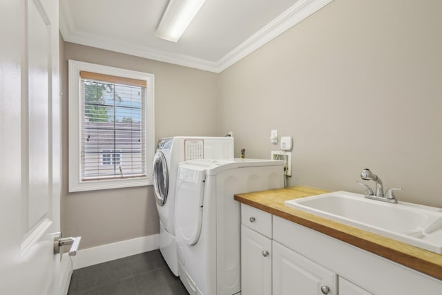 6 Murphy Ct, Blauvelt, NY 10913 - laundry room with washing machine and dryer, ornamental molding, dark tile patterned floors, cabinet space, and baseboards
