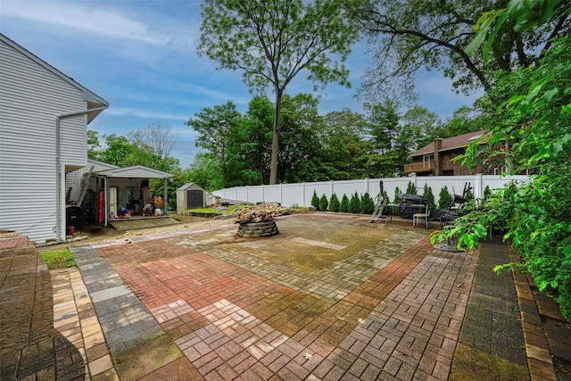 15 Oakhurst St, Huntington Station, NY 11746 - fenced backyard with a storage unit, a patio area, and outdoor dining space