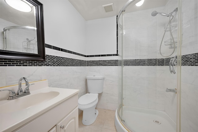 15 Oakhurst St, Huntington Station, NY 11746 - full bath with vanity, a stall shower, tile walls, and tile patterned floors