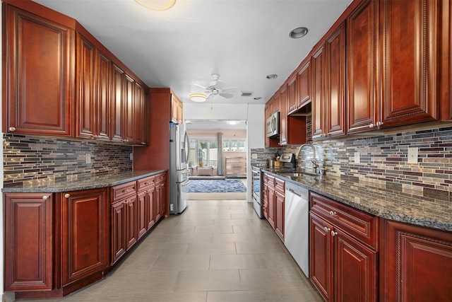 15 Oakhurst St, Huntington Station, NY 11746 - kitchen featuring ceiling fan, reddish brown cabinets, stainless steel appliances, and recessed lighting