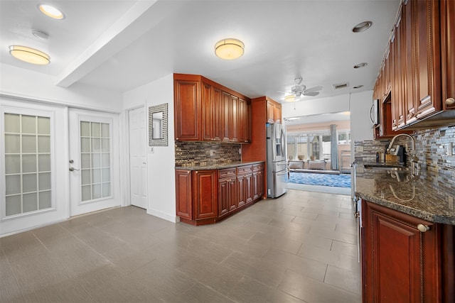 15 Oakhurst St, Huntington Station, NY 11746 - kitchen with tasteful backsplash, reddish brown cabinets, appliances with stainless steel finishes, a ceiling fan, and recessed lighting