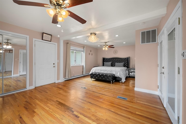 15 Oakhurst St, Huntington Station, NY 11746 - bedroom with light wood finished floors, a baseboard heating unit, recessed lighting, and a ceiling fan
